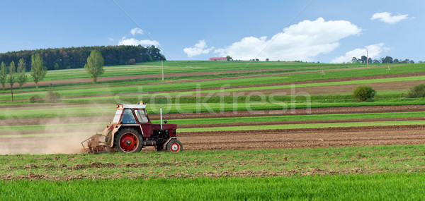 Small tractor harrow on the spring field Stock photo © lightkeeper