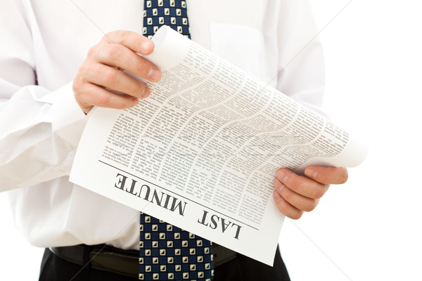 Businessman reading paper looking for opportunities Stock photo © lightkeeper