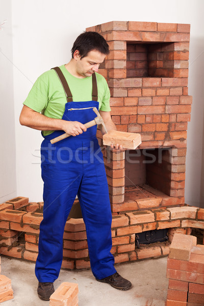 Man building masonry heater Stock photo © lightkeeper