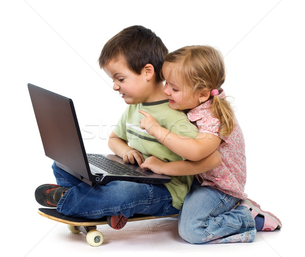 Kids with laptop playing Stock photo © lightkeeper