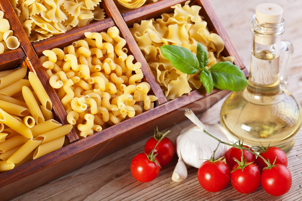 Pasta assortment and seasoning ingredients Stock photo © lightkeeper