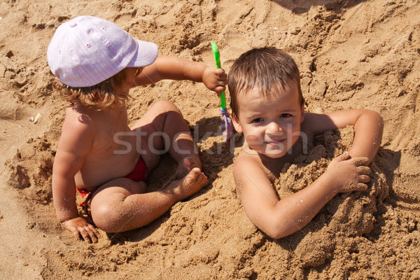 Stock photo: Kids playing in sand