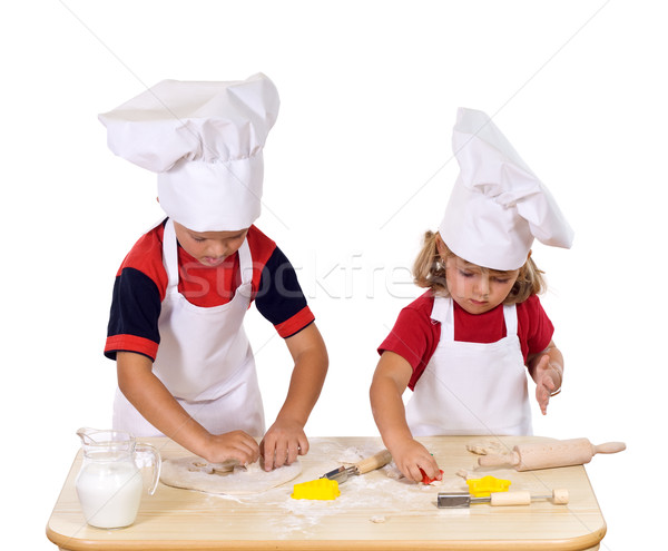 Children making cookies dressed as chefs Stock photo © lightkeeper