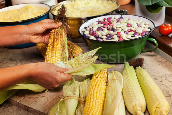 Woman preparing fresh produce for cooking or processing Stock photo © lightkeeper
