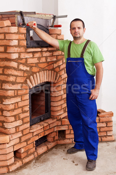 Worker building a masonry heater Stock photo © lightkeeper
