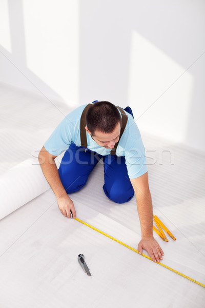 Stock photo: Laying laminate flooring at home