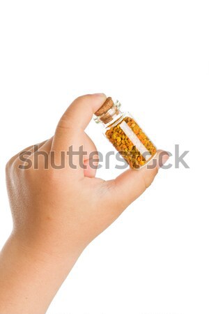 Small bottle with pollen in child hand Stock photo © lightkeeper