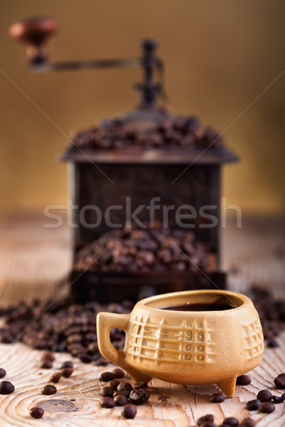 A cup of coffee and old coffee grinder Stock photo © lightkeeper