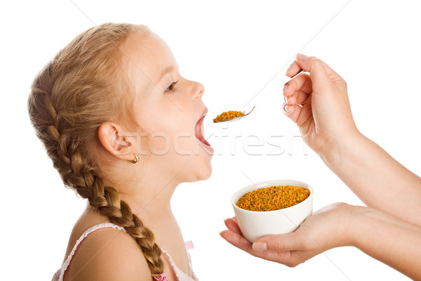 Little girl taking pollen - traditional remedies Stock photo © lightkeeper