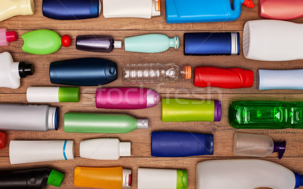 Colorful plastic bottles on wooden surface Stock photo © lightkeeper