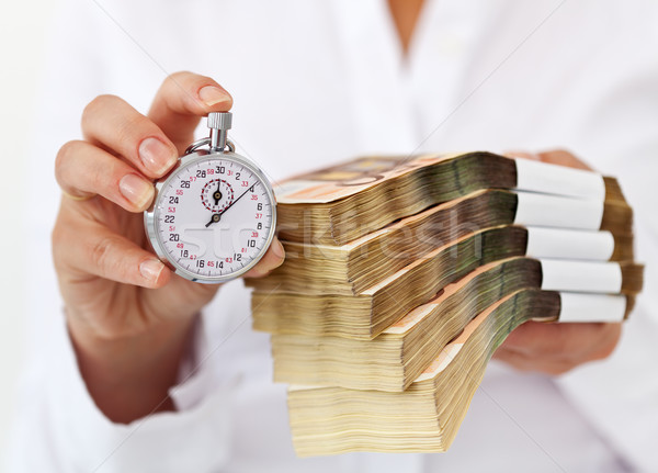 Tijd bieden geld stopwatch vrouw Stockfoto © lightkeeper