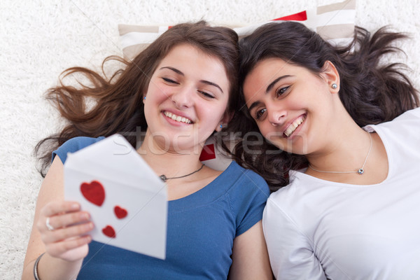 Girls having fun reading love letter together Stock photo © lightkeeper