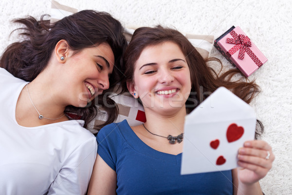 Happy young girls reading love letter Stock photo © lightkeeper