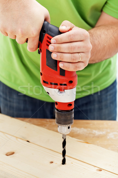 Carpenter or joiner drilling hole Stock photo © lightkeeper