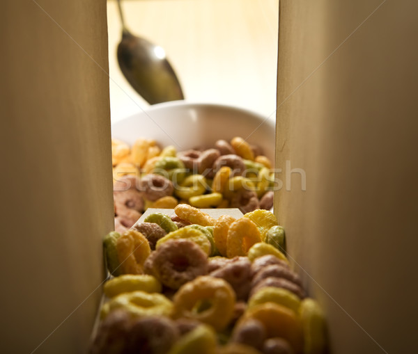 Stock photo: Cereal loops pouring out of the box