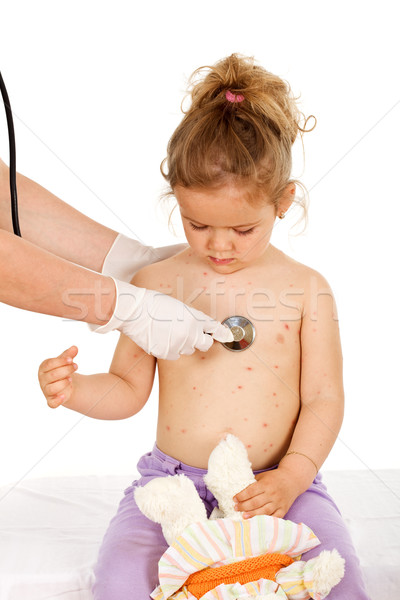 Kid with skin rash being examined at the physician Stock photo © lightkeeper
