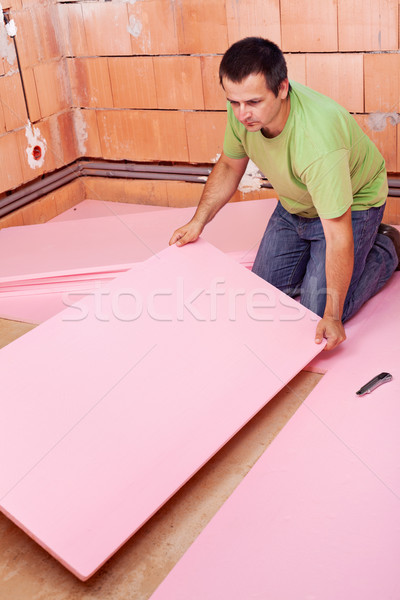Fektet padló szigetelés réteg új ház férfi Stock fotó © lightkeeper