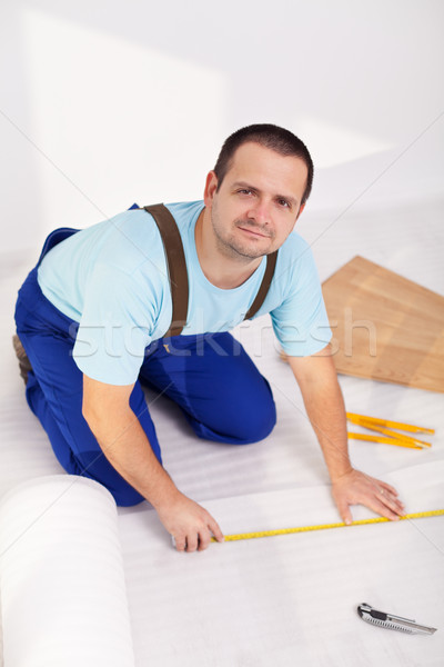 Man laying laminate floor at home Stock photo © lightkeeper