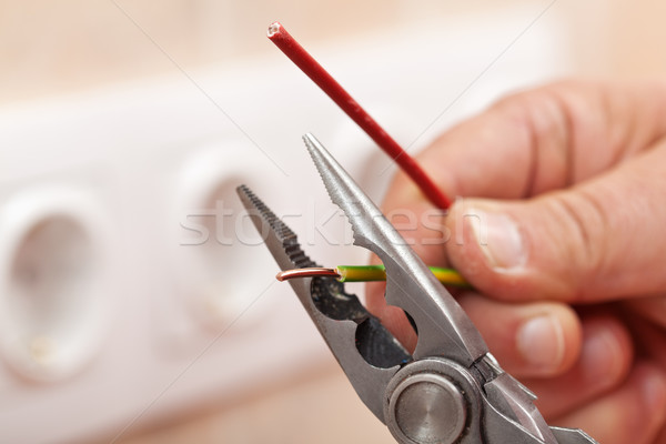 Stock photo: Pliers peeling copper wires - closeup