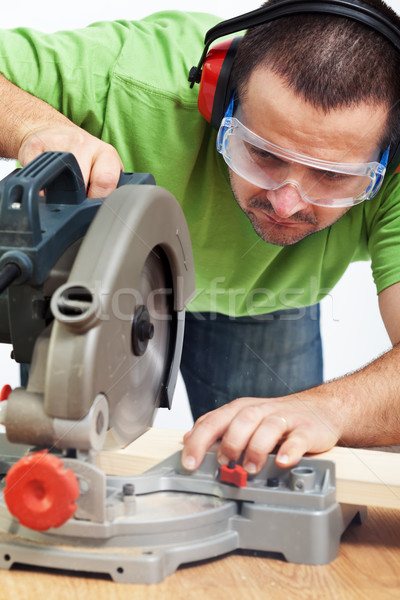 Carpenter or joiner working with power tool Stock photo © lightkeeper