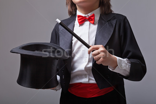 Magician holding magic hat and wand Stock photo © lightkeeper