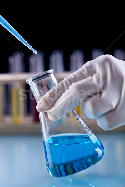 Chemical experiment concept with Erlenmeyer flask and pipette Stock photo © lightkeeper