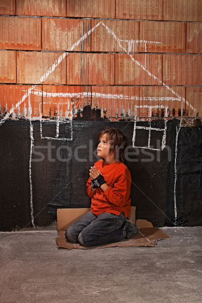 Poor homeless beggar boy praying for a shelter concept Stock photo © lightkeeper