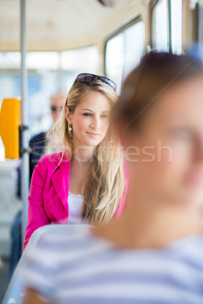 Pretty, young woman on a streetcar/tramway Stock photo © lightpoet