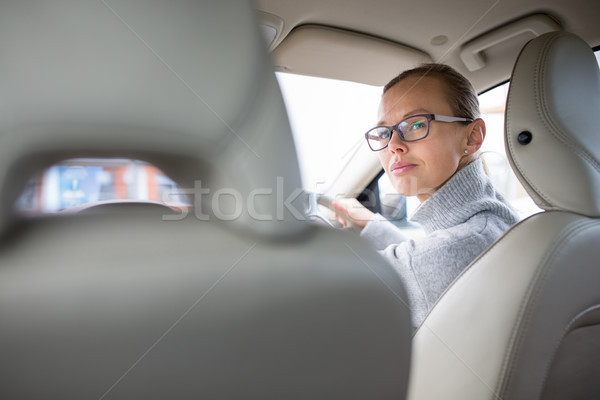 Woman driving a car - female driver at a wheel of a modern car  Stock photo © lightpoet