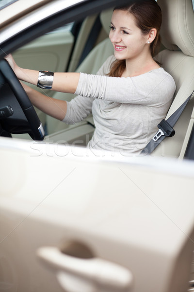 Pretty young woman driving her new car  Stock photo © lightpoet