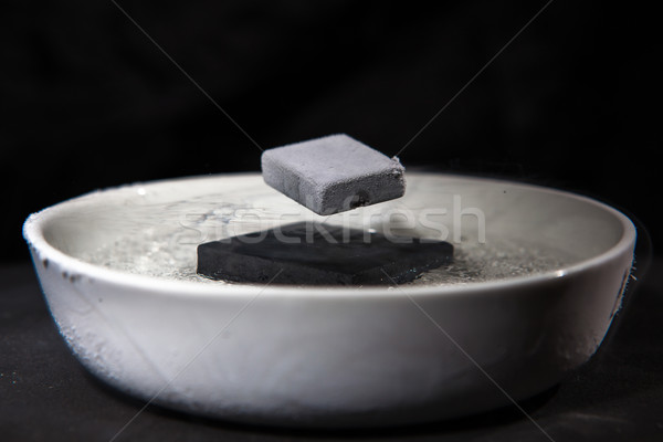 Physics in action - experiment with supraconductive materials Stock photo © lightpoet