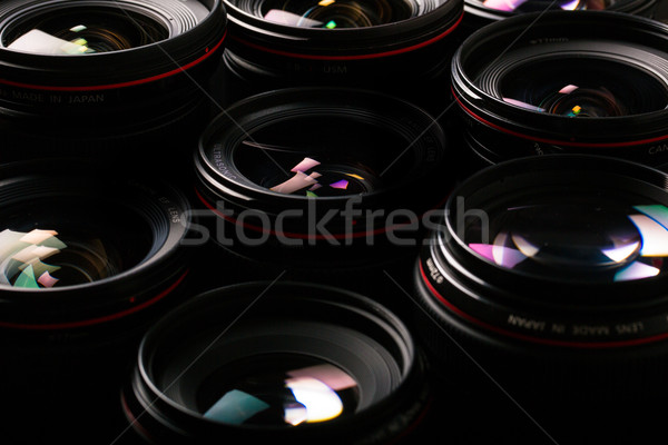 Modern camera lenses with reflections, low key image Stock photo © lightpoet