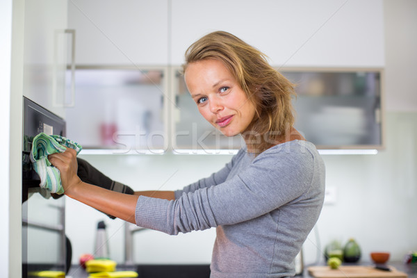 Senior woman cooking in the kitchen - eating and cooking  healthy Stock photo © lightpoet