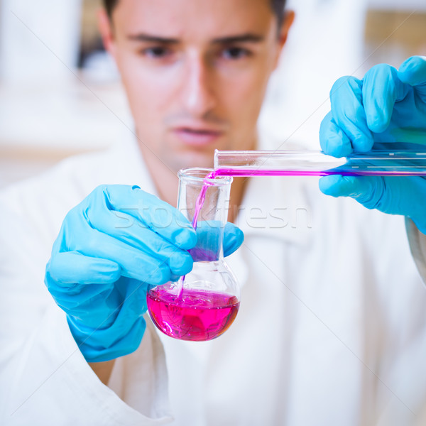 young male researcher carrying out scientific research in a lab  Stock photo © lightpoet