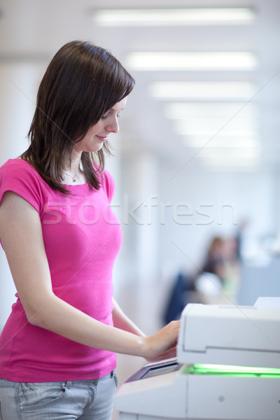 [[stock_photo]]: Joli · jeune · femme · copier · machine · peu · profond