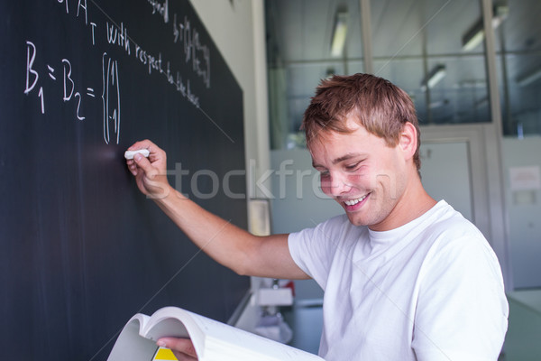 Stock photo: Portrait of a very happy young, male college student