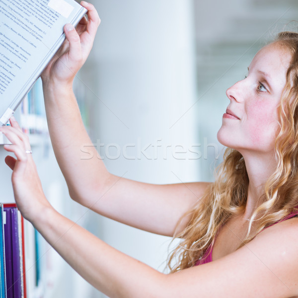 pretty female college student in a library Stock photo © lightpoet