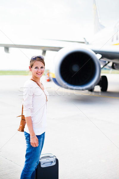 Young woman at an airport having just left the aircraft Stock photo © lightpoet