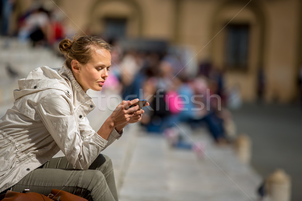 Gorgeous female tourist with a map discovering a foreign city Stock photo © lightpoet