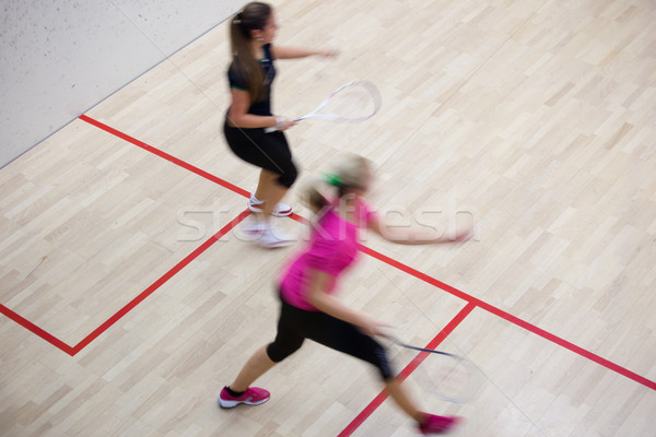 Two female squash players in fast action on a squash court  Stock photo © lightpoet