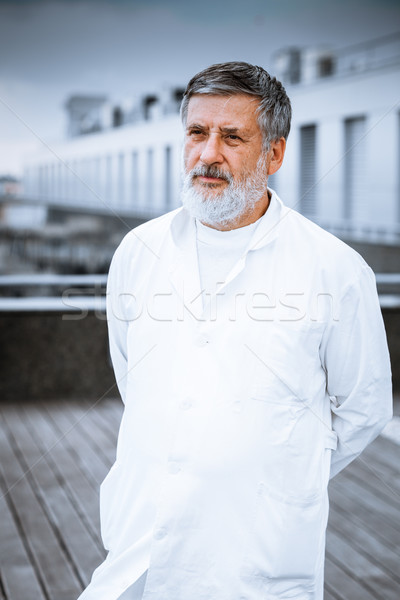 Renowned scientist/doctor standing on the roof of the research Stock photo © lightpoet