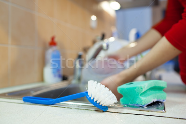  woman hands rinsing dishes under running water in the sink Stock photo © lightpoet