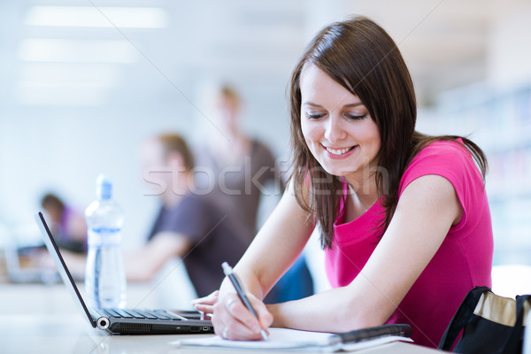 female student with laptop and books working in a high school library Stock photo © lightpoet