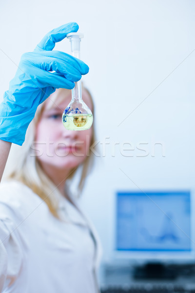 female researcher/chemistry student carrying out experiments in a lab Stock photo © lightpoet