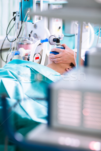 Anesthesia - patient under narcosis, breathing through a mask  Stock photo © lightpoet