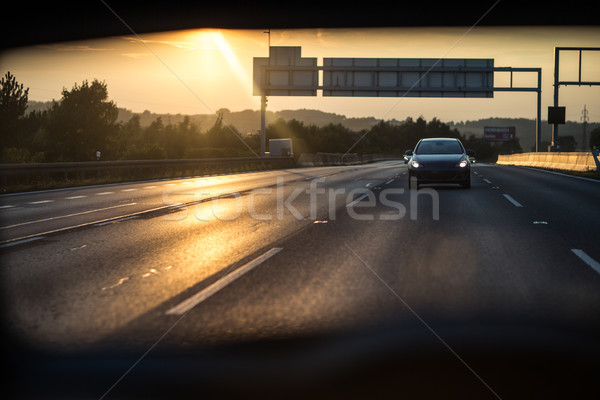 Cars on a highway at sunset Stock photo © lightpoet