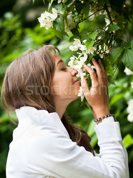 Güzel genç kadın beyaz yasemin çiçekler kadın Stok fotoğraf © lightpoet