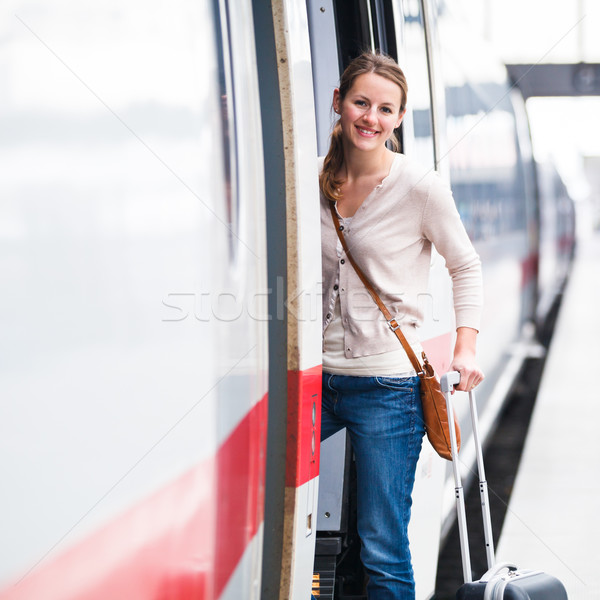 Csinos fiatal nő beszállás vonat város városi Stock fotó © lightpoet