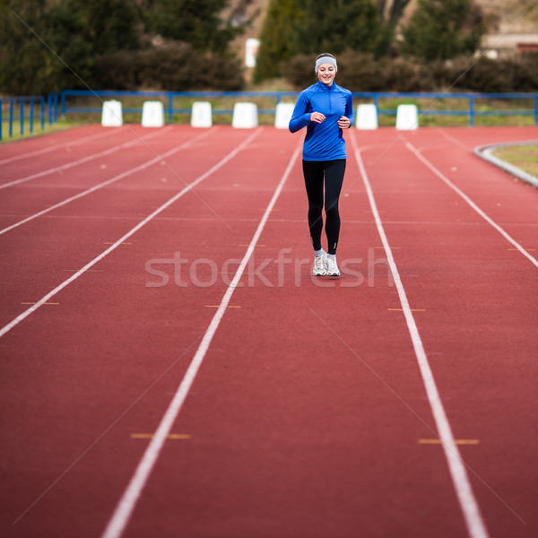若い女性 を実行して トラック フィールド スタジアム 女性 ストックフォト © lightpoet