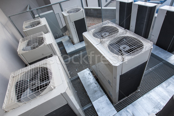 Air conditioning equipment atop a modern building Stock photo © lightpoet